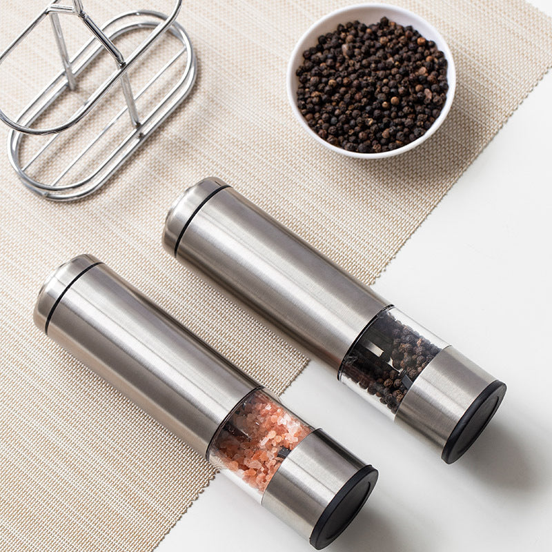 Two Stainless Steel Electric Pepper Mills With Racks