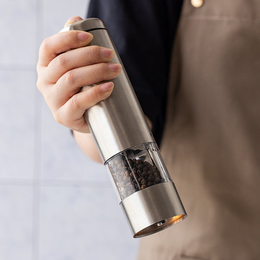 Two Stainless Steel Electric Pepper Mills With Racks